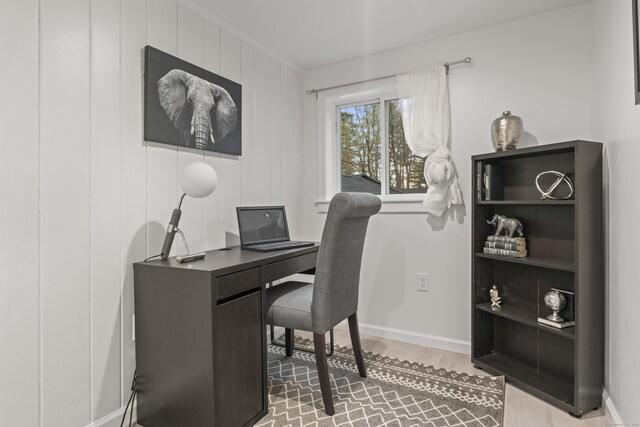 office space with wood-type flooring