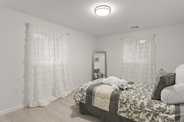 bedroom with light hardwood / wood-style flooring