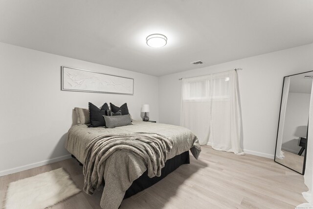 bedroom featuring light wood-type flooring