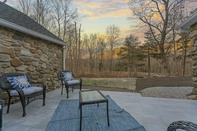 view of patio terrace at dusk