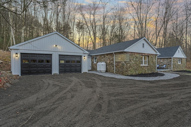 property exterior at dusk with a garage