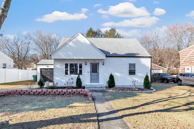 view of front facade featuring a front yard and a garage