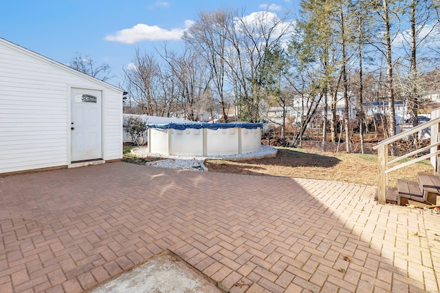 view of patio with a covered pool