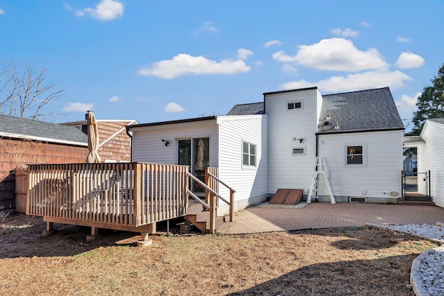 back of property featuring a patio and a wooden deck