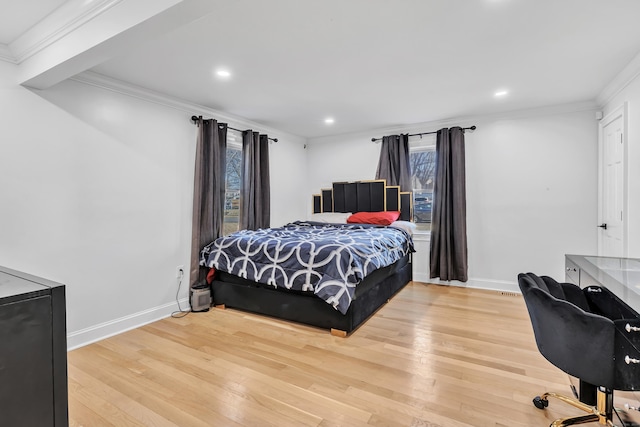 bedroom featuring hardwood / wood-style floors and ornamental molding