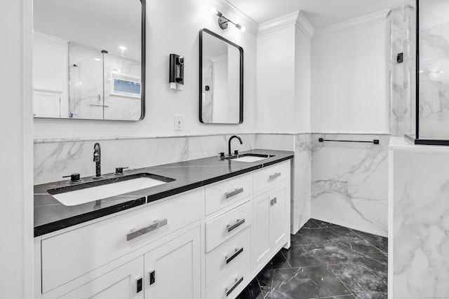 bathroom featuring vanity, a shower with door, and ornamental molding