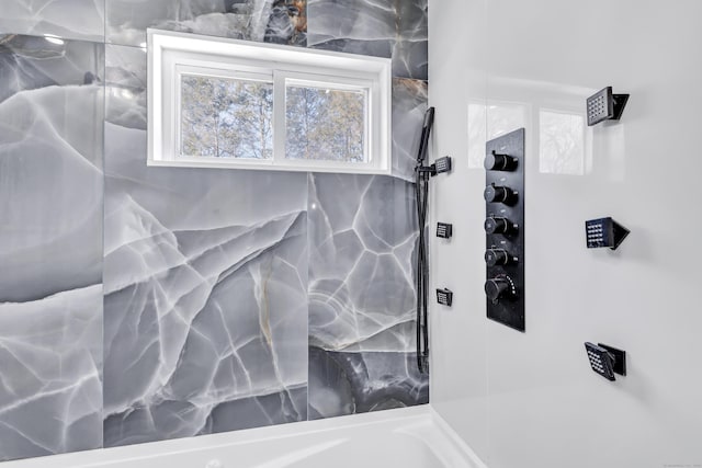 bathroom with tiled shower