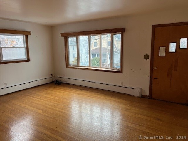 foyer entrance with light hardwood / wood-style floors