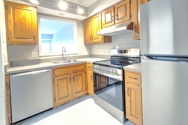 kitchen with sink and appliances with stainless steel finishes