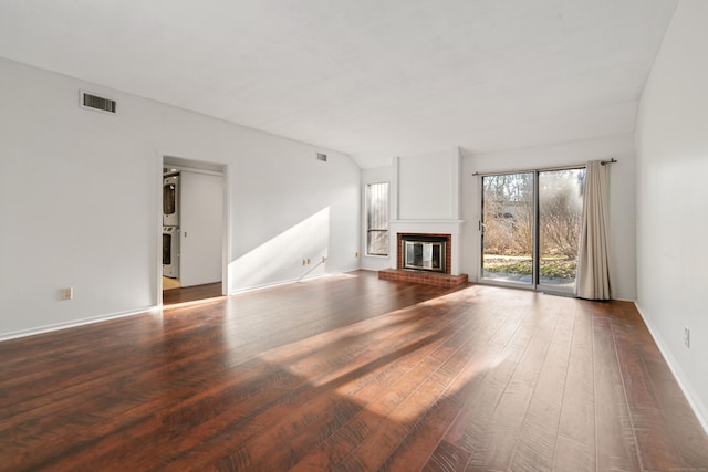 unfurnished living room with a fireplace and dark wood-type flooring