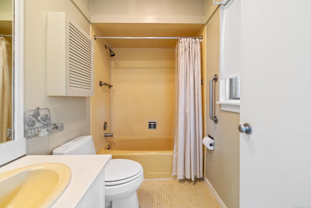 full bathroom featuring tile patterned floors, vanity, toilet, and shower / tub combo with curtain