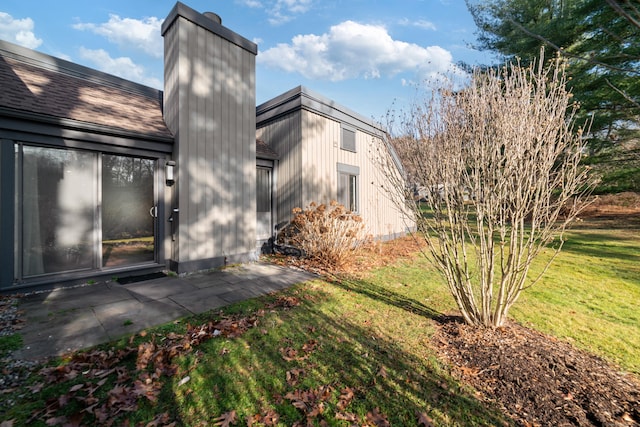 view of home's exterior featuring a yard