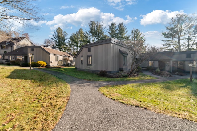 view of property exterior featuring a yard