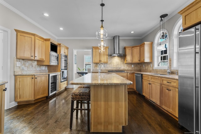 kitchen featuring dark wood-style floors, wine cooler, appliances with stainless steel finishes, a sink, and wall chimney exhaust hood