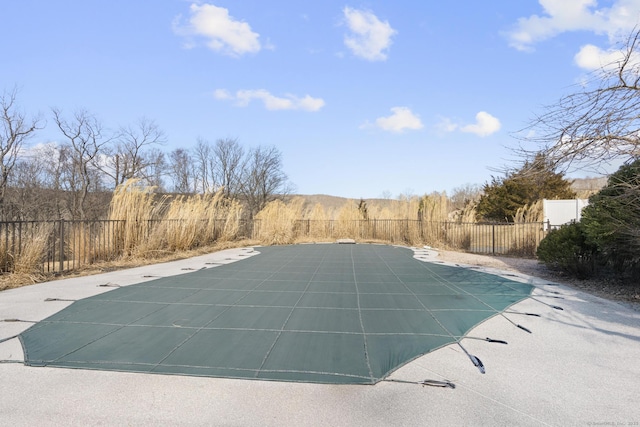 view of pool featuring a patio area, fence, and a fenced in pool