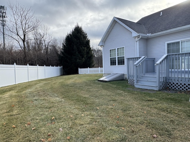 view of yard with a wooden deck