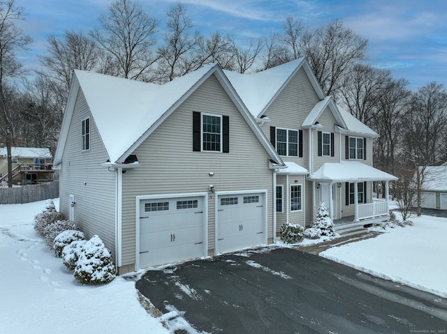 view of front of property with a garage and covered porch