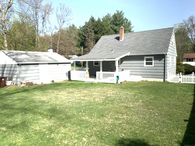 31 Gary Dr, Enfield, CT 06082 - rear view of house featuring a chimney and a shingled roof