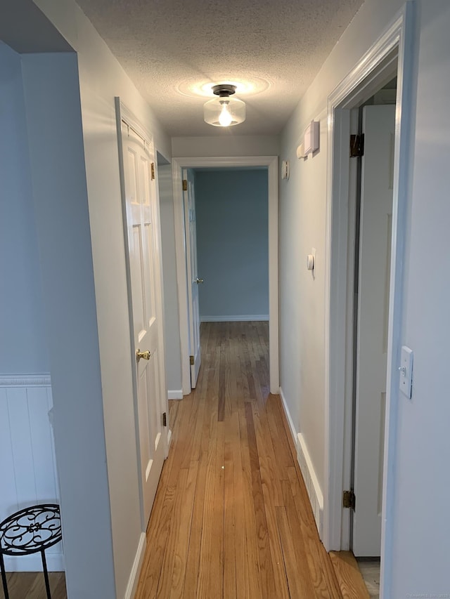 31 Gary Dr, Enfield, CT 06082 - corridor with a textured ceiling and light wood finished floors