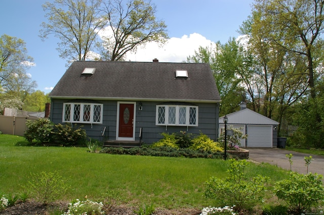 31 Gary Dr, Enfield, CT 06082 - new england style home with an outdoor structure, a detached garage, a shingled roof, and a front lawn