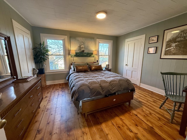 bedroom featuring hardwood / wood-style floors and ornamental molding