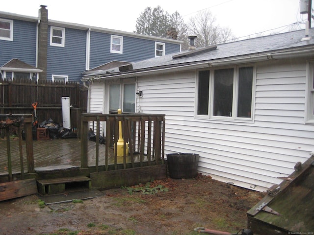 rear view of house featuring a deck