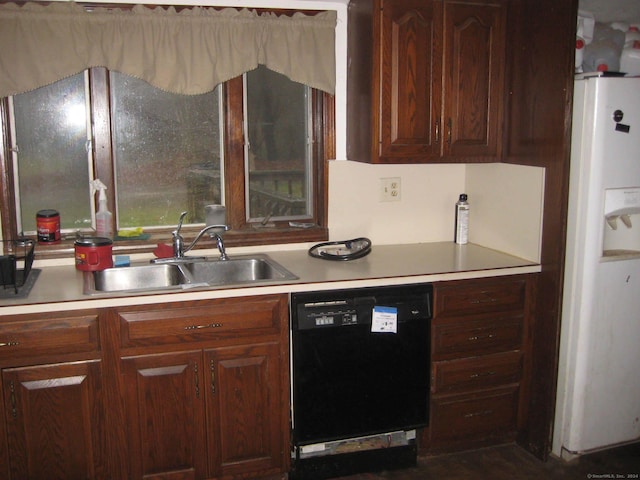 kitchen with sink, white refrigerator, and black dishwasher