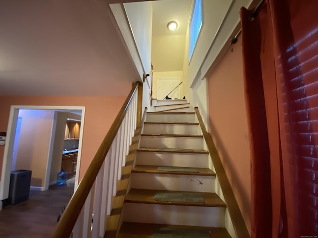 stairway with wood-type flooring