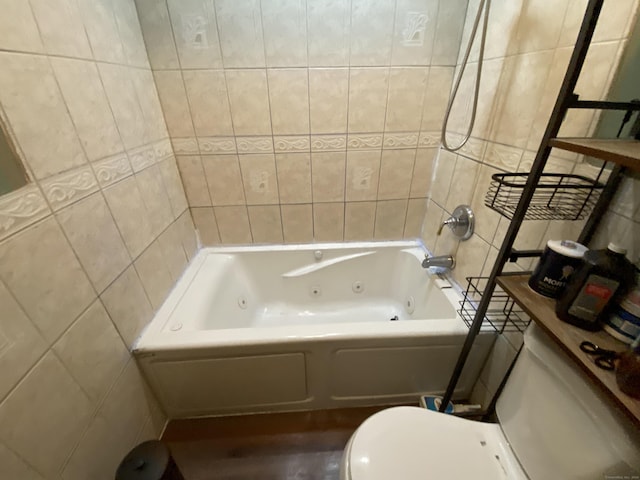 bathroom with shower / bathtub combination, toilet, and tile walls