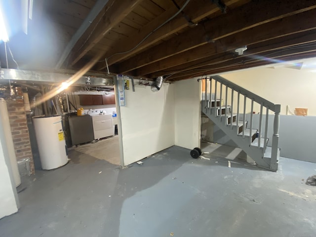 basement featuring separate washer and dryer and gas water heater