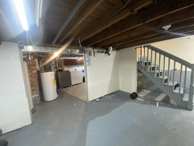 basement with separate washer and dryer and water heater