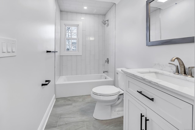 full bathroom featuring vanity, tiled shower / bath combo, and toilet