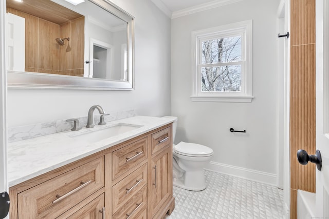 bathroom with vanity, toilet, and crown molding