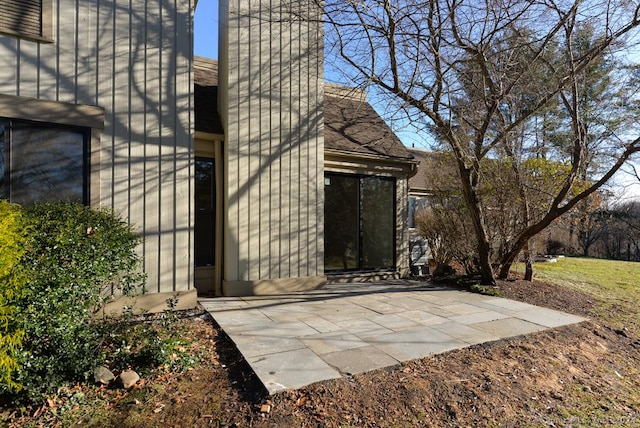 property entrance featuring a patio area