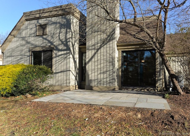 property entrance with a patio area