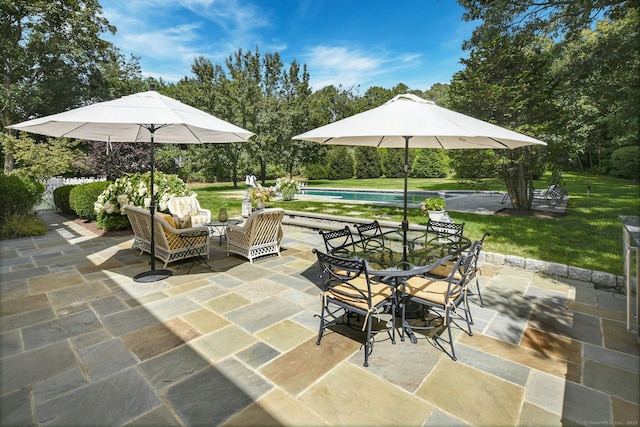 view of patio with outdoor dining area, outdoor lounge area, and an outdoor pool