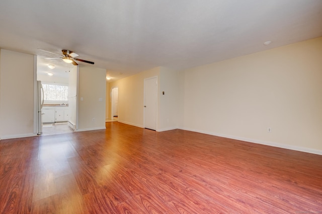 empty room with wood-type flooring and ceiling fan