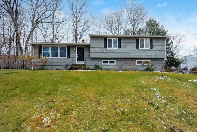 tri-level home with a front yard