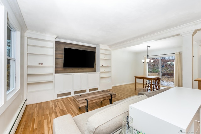 living room featuring a notable chandelier, light wood-type flooring, crown molding, and a baseboard radiator