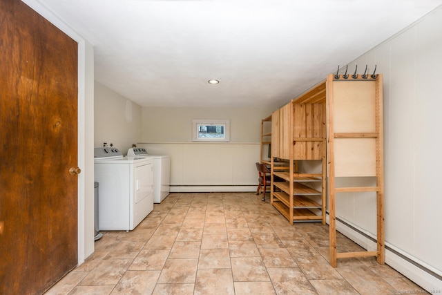 washroom featuring separate washer and dryer and a baseboard heating unit