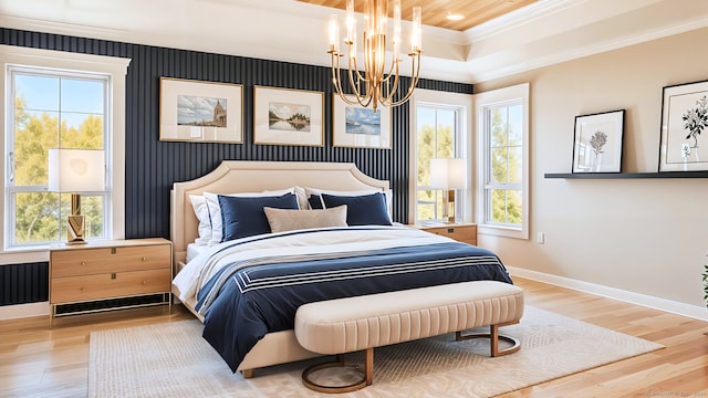 bedroom featuring multiple windows, ornamental molding, and hardwood / wood-style flooring