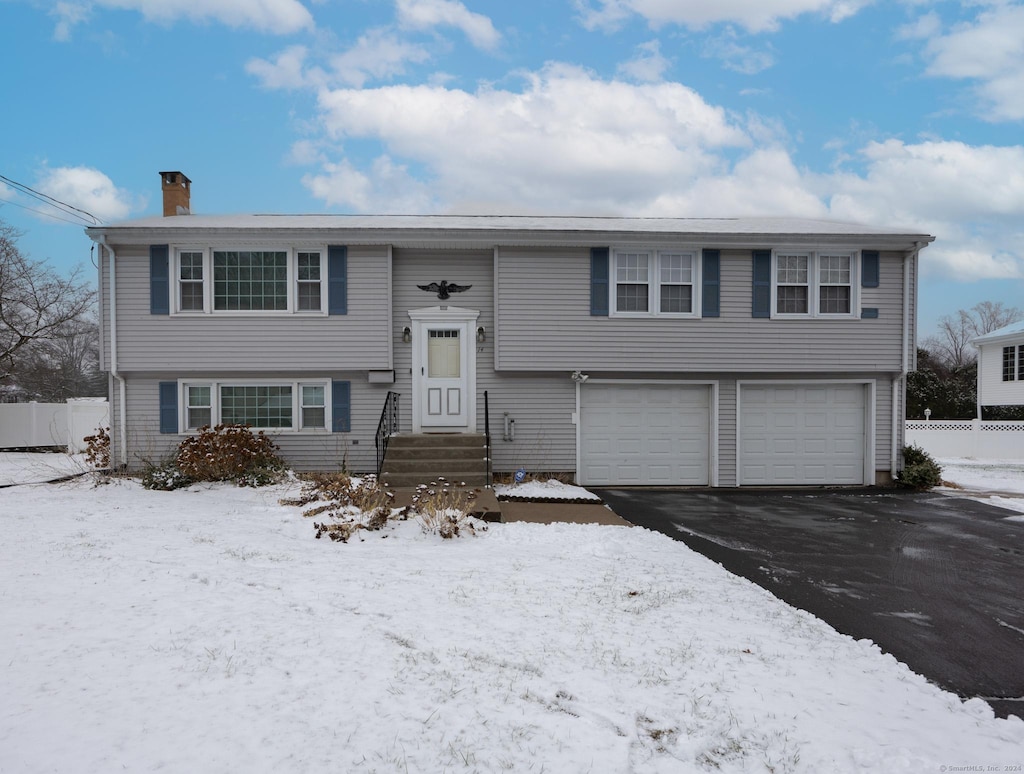 split foyer home featuring a garage