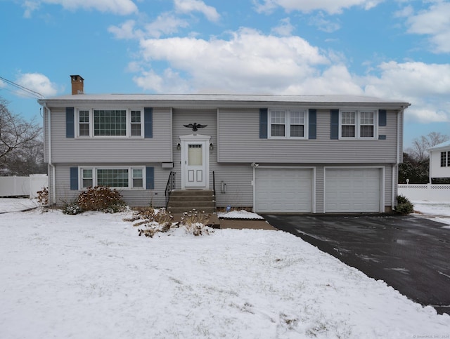 split foyer home featuring a garage