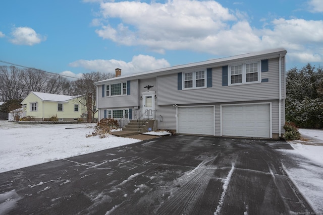 split foyer home featuring a garage