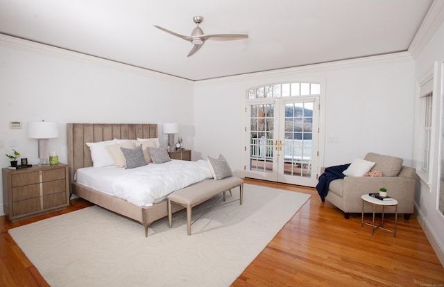 bedroom featuring ceiling fan, ornamental molding, french doors, wood finished floors, and access to outside