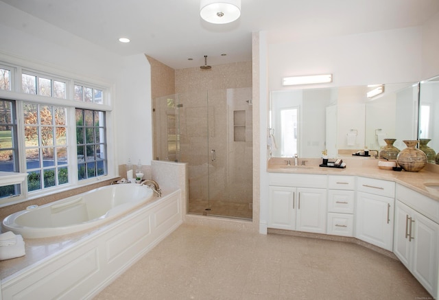 full bath with vanity, a shower stall, and a bath