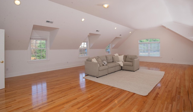 living room with visible vents, a healthy amount of sunlight, and light wood-style flooring