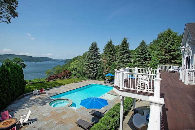 266 Great Plain Rd, Danbury, CT 06811 - view of swimming pool featuring a patio area, a pool with connected hot tub, and a water view
