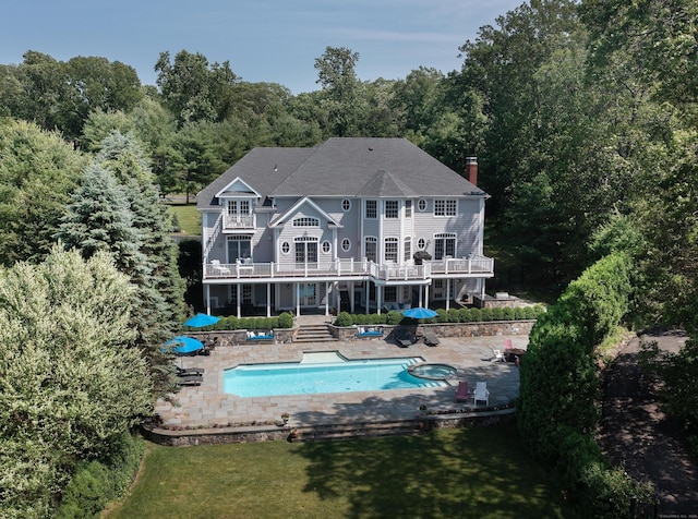 266 Great Plain Rd, Danbury, CT 06811 - back of property with a patio area, a wooden deck, stairway, an outdoor pool, and a chimney