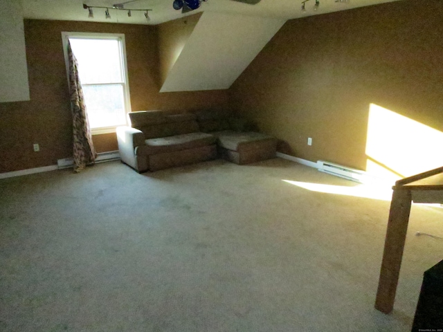 additional living space featuring light colored carpet and a baseboard radiator